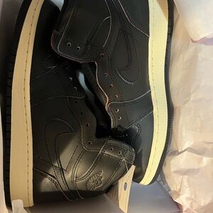 Nike Black High-Top Sneakers with Cream Sole and Subtle Red Stitching